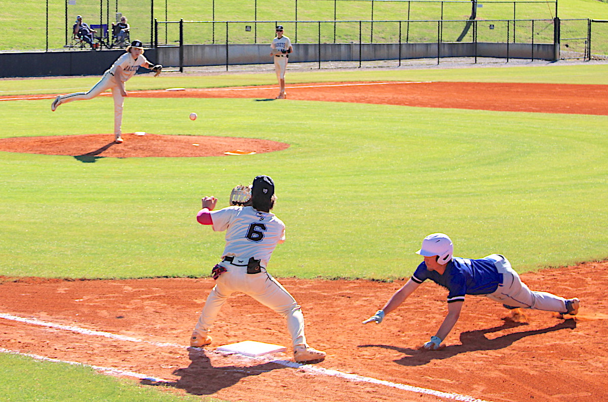 Jackson Sellers whips the ball to first baseman Landon Cheeks, No. 6, as the Yellow Jackets attempt to pick off a Hiawassee Dam baserunner.