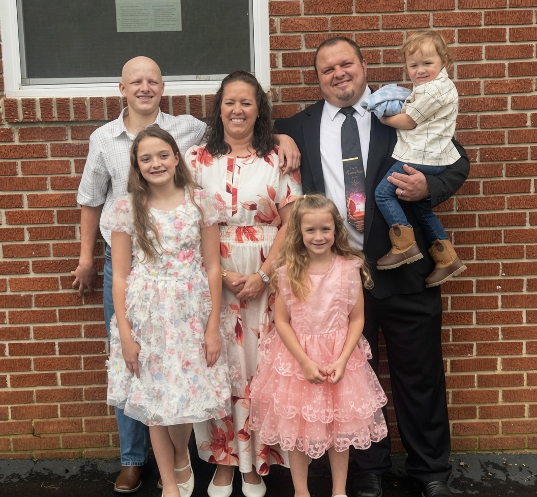 Father, pastor, coach and now athletic director, Kenneth Dockery poses for an Easter photo with his family. Front, from left, Leah and Lydia; back, Luke, Hope, Kenneth and Laban.