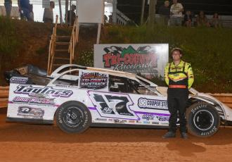 Tucker Anderson is all smiles in victory lane following his main event win.