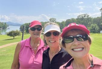 From left, golfers Linda Miles, Judy Aube and Linda Robinson take a break from the heat.