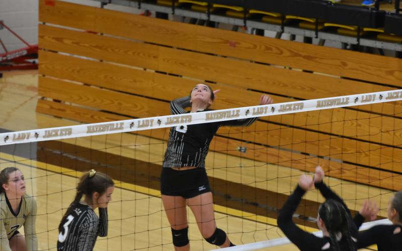 Jade Patterson awaits a floating ball so she can swat it to the floor for a kill.    Travis Dockery • Clay County Progress