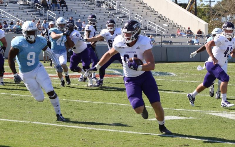 (Submitted • Catamount Sports) Tyrie Adams runs away from defenders. Adams accounted for nearly 300 yards of offense and two touchdowns.