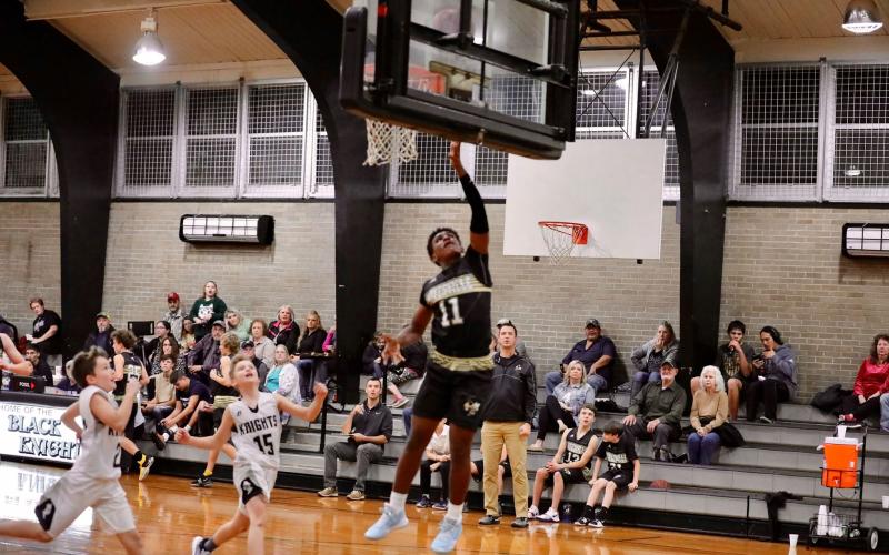 (Kelli Graves  • Clay County Progress) Asher Brown goes up for 2 of his team-leading 26 points against Robbinsville.