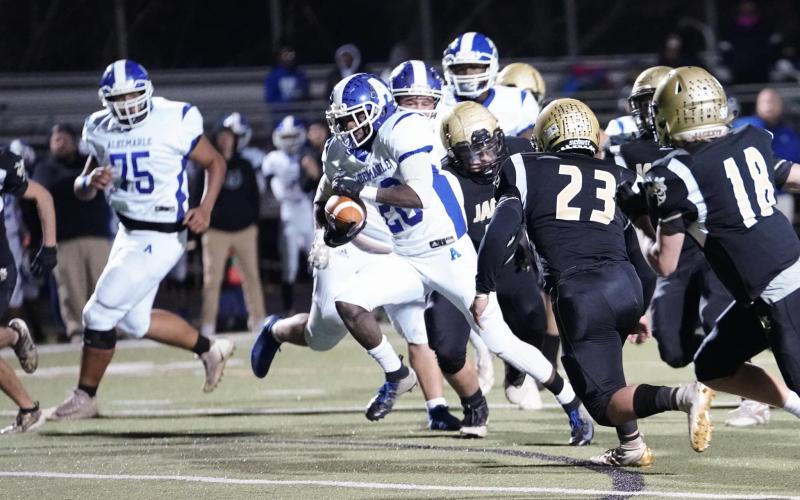 (Kelli Graves • Clay County Progress) Hayesville’s defense struggles to contain Albemarle’s Julius Smith during Friday’s playoff game.