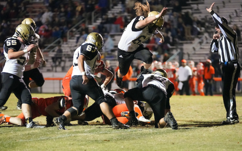 Kelli Graves • Clay County Progress Dalson Stanley takes to the air to avoid a possible late hit penalty.