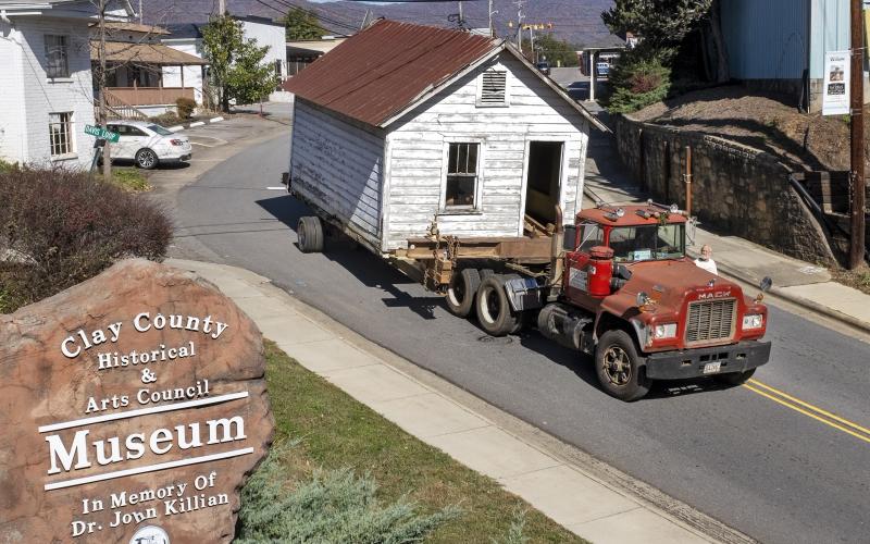 The old Hayesville Town Hall came slowly down Main Street on equipment provided by Smith House Movers.