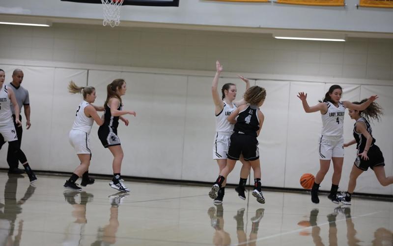 Photo by Kelli Graves / Clay County Progress: Lady Jackets pair off with Robbinsville while orchestrating a rally.