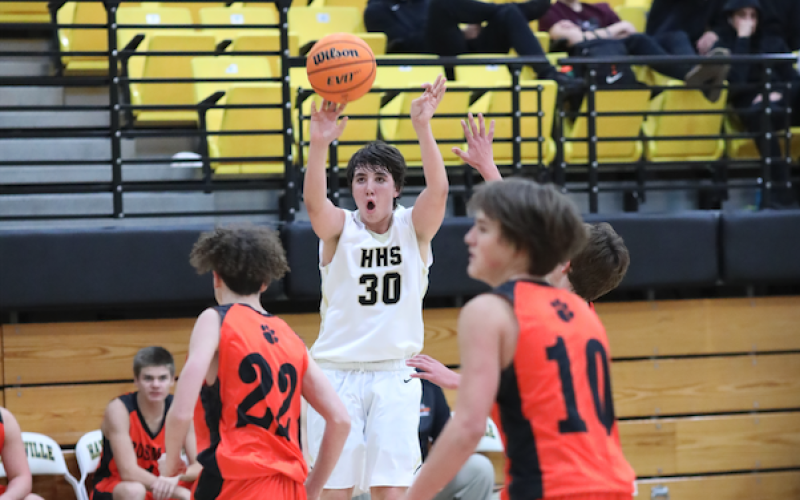 (Kelli Graves • Clay County Progress) Peyton Hunt lets a shot fly in his 16-point game against Rosman.