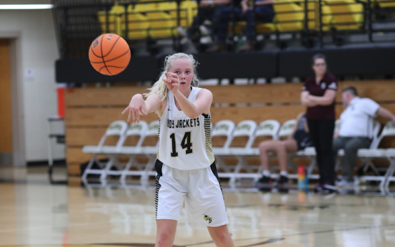 (Kelli Graves • Clay County Progress) Cecilia Jones fires a pass to an open Lady Jacket in Hayesvilles victory.