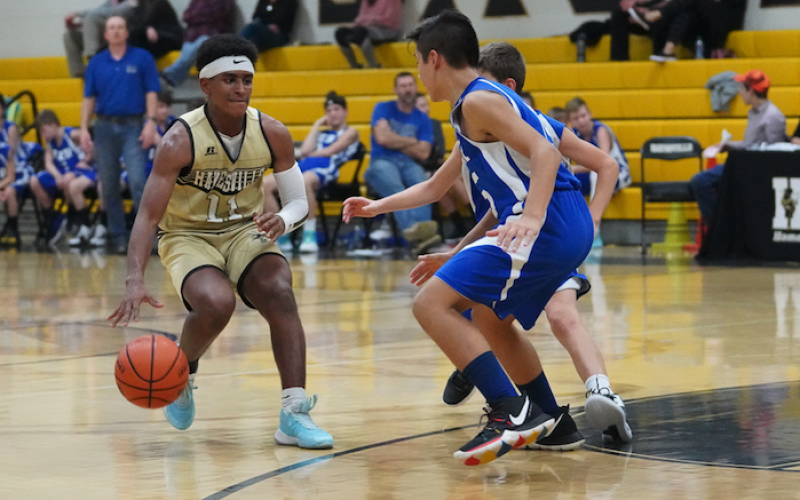 (Kelli Graves • Clay County Progress) Asher Brown uses smooth ball-handling skills to keep possesion.