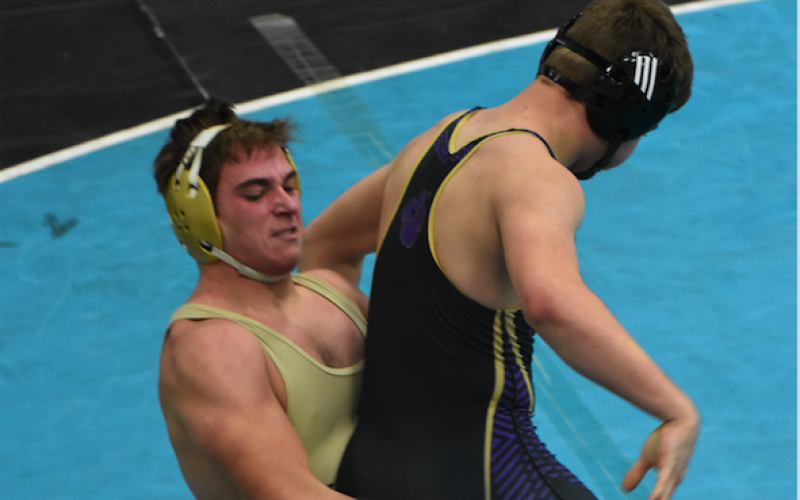 (Travis Dockery • Clay County Progress) Ethan Taylor uses leverage to take his opponent off the ground.