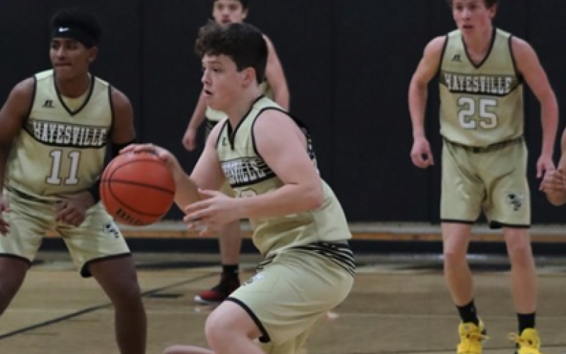 (Kelli Graves * Clay County Progress) Taylor McClure snags a steal and leads the Jackets up the floor.