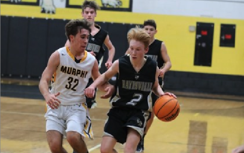 (Kelli Graves * Clay County Progress) Will Englemann tries to evade a Bulldog defender on Thursday.