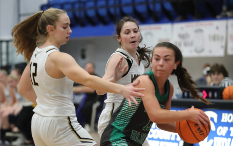 (Photo by Kelli Graves / Clay County Progress) Lila Payne and Breanna Burnette try to trap a Lady Eagle.