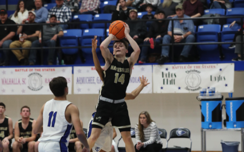 (Kelli Graves / Clay County Progress) Sophomore point guard Kolbe Ashe goes airborne for 2 points in the semifinal round.
