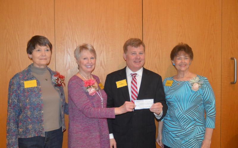 (Lorrie Ross • Clay County Progress) Erlanger Western Carolina CEO Mark Kimball accepts a check for $72,550 from Granny's Attic officers, from left, Sandy Jersey, Karen Robinson, Kimball and Debbie Thrower.