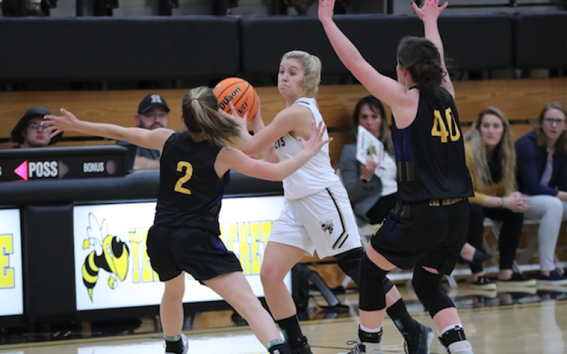 (Kelli Graves • Clay County Progress) Annie Brooks looks for an open passing lane against Highlands.