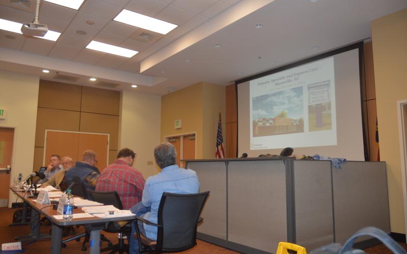 (Lorrie Ross • Clay County Progress) Clay County's Board of Commissioners viewed a Powerpoint presentation by Erlanger CEO Mark Kimball, who said the hospital had made  five and half million dollars in capital investments in western North Carolina with building improvements for clinics, technology updates and more.
