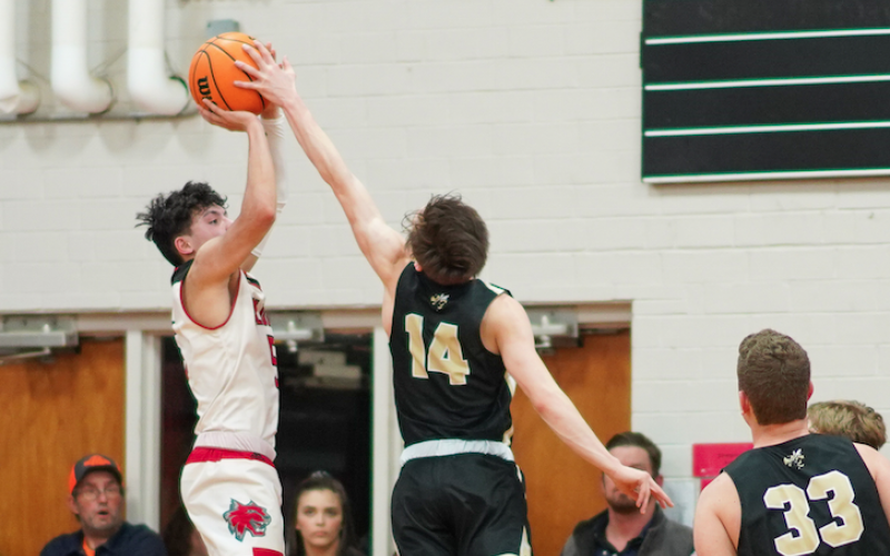 (Kelli Graves• Clay County Progress) Sophomore Kolbe Ashe reaches out just in time to stop a Wildcat shooter during Monday night’s game.