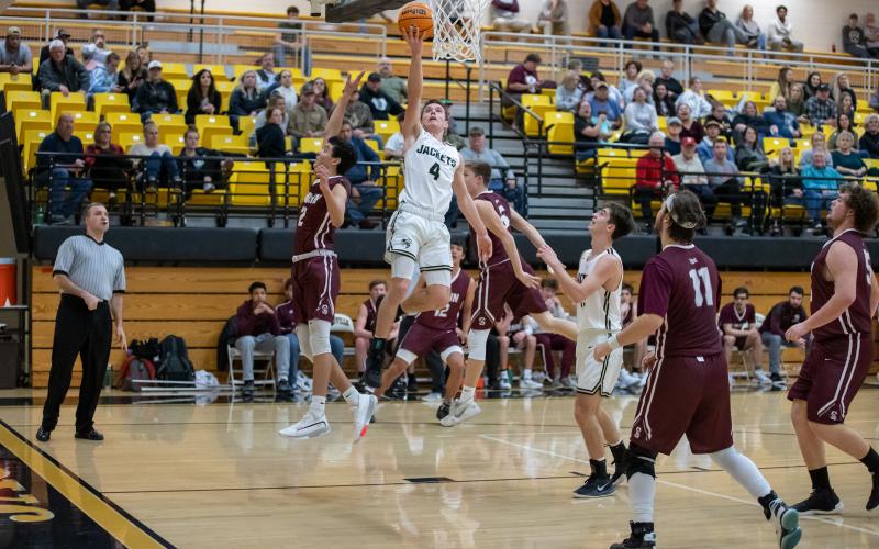 (Kelli Graves • Clay County Progress) Hayesville’s Hayden McClure takes to the air for the score. McClure caused trouble for Swain on both ends of the court.