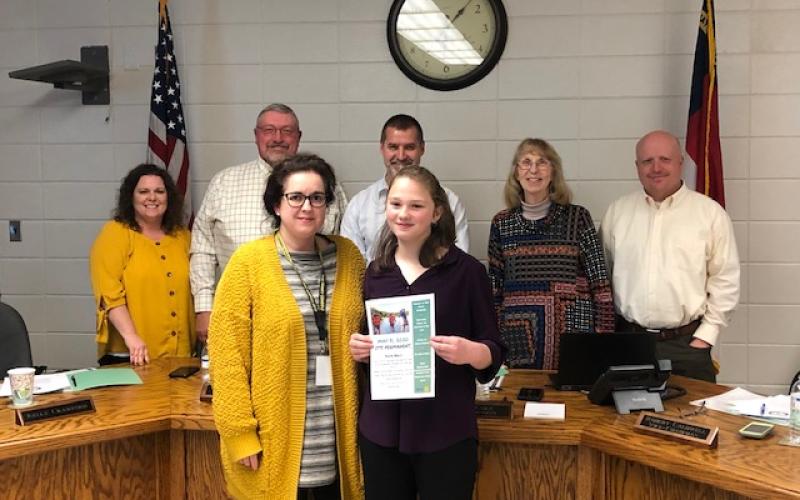 (Lorrie Ross • Clay County Progress) HMS student Lauren Gottlieb (left front) by Hayesville Middle School AIG program director Kim Worley (right front) Gottlieb received a scholarship through the North Carolina Association for Gifted and Talented to do a suicide prevention awareness youth rally. She plans to host “It’s Permanent” Youth Rally on May 31.
