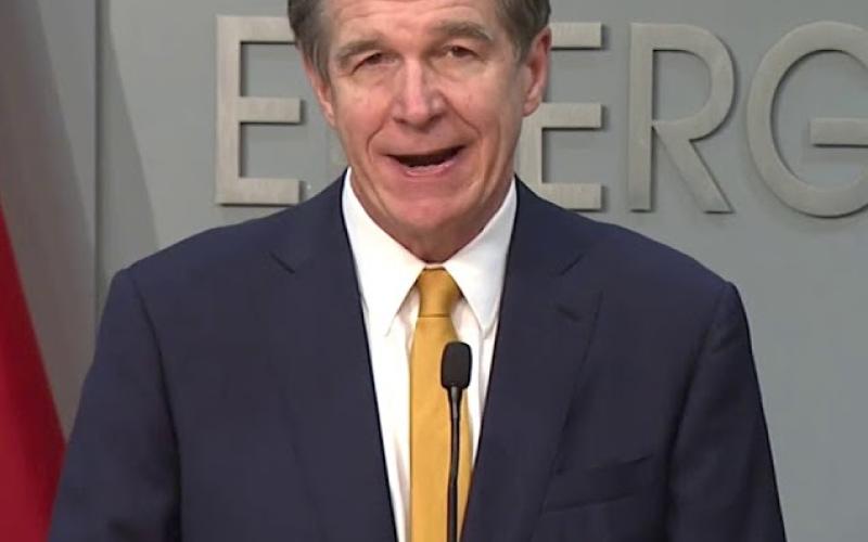 Gov. Roy Cooper explains the steps in the Phase I modification to his Stay At Home Executive Order.