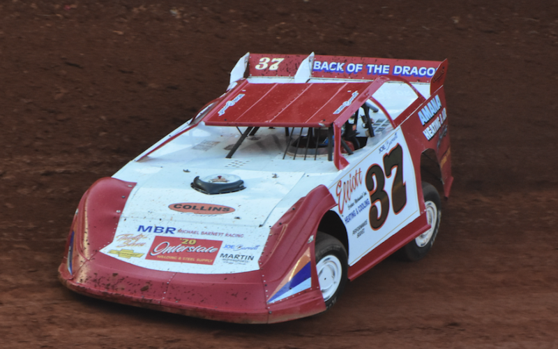 Travis Dockery • Clay County Progress Michael “Spanky” Barnett rips through turn three and his way to a Modified hobby win.