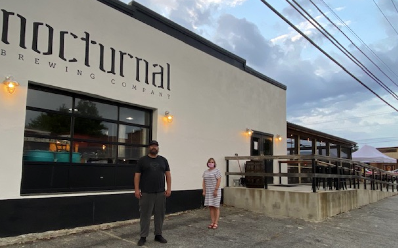 •Curt Wheeler Mike Plummer, owner of Nocturnal, gave Sherry Adams, of the North Carolina Department of Commerce, a tour of his building which was renovated with help from the Solutions Fund available through North Carolina Small Town Main Street.