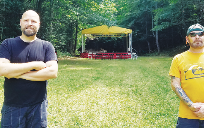 Samantha Sinclair • Cherokee Scout Johnny Scroggs and Bert Zimmerman are preparing Dog Branch Grounds in Brasstown for its first of monthly concerts.