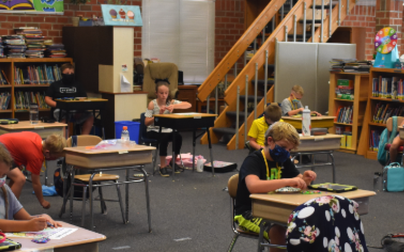 (Travis Dockery • Clay County Progress) Elementary students wear masks and are socially distanced while spending some quality time in the Hayesville school library.