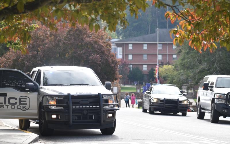 (Becky Long • Clay County Progress) Towns County Sheriff’s officers and other law enforcement agencies block entrances to Young Harris College Monday afternoon.