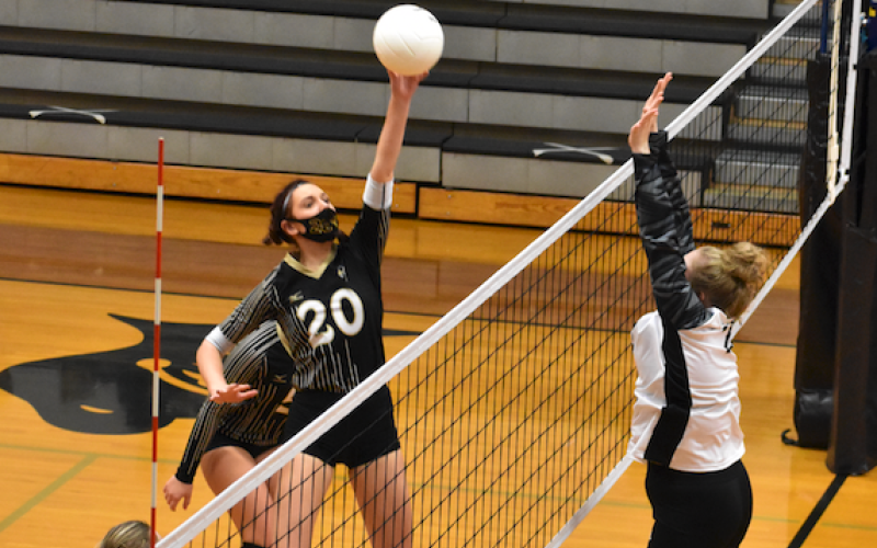 (Kevin Hensley • Graham Star) High flying Hallie Johnson soars in an attempt to keep a volley alive.