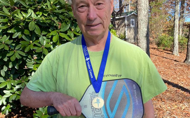 Travis Dockery • Clay County Progress Pickleballer Fred Sickel shows off his Senior Games gold medal and the paddle that helped him earn it.