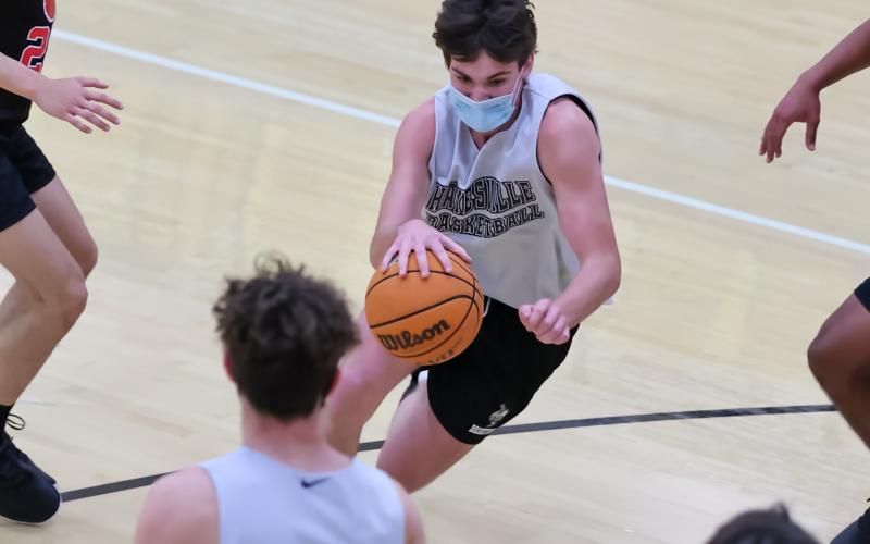 (Kelli Graves • Clay County Progress) Senior Paul White sees an opening and drives through the lane against Franklin.