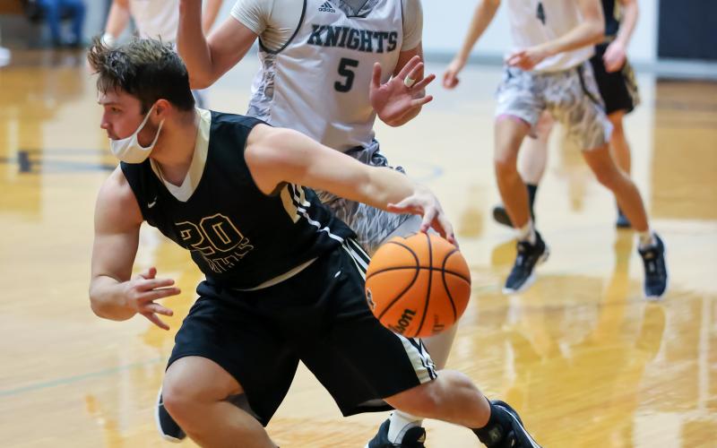 Kelli Graves • Clay County Progress Blake McClure lowers a shoulder and drives past a Black Knight.