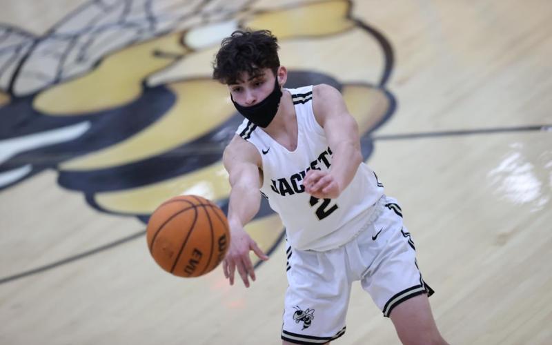 (Kelli Graves • Clay County Progress Senior) Logan Caldwell shoots a pass through a small window in Hayesville's game against Mountain Island Charter.