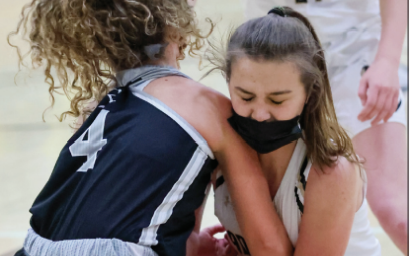 (Kelli Graves • Clay County Progress)Lila Roberts locks onto a lose ball, causing a jump ball against Robbinsville.