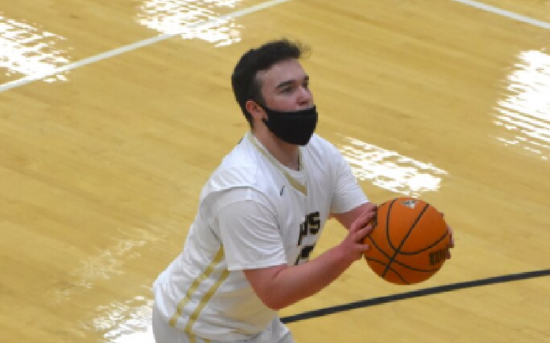 (Travis Dockery • Clay County Progress) Contact under the basket sends Nate Trhlin to the foul line.