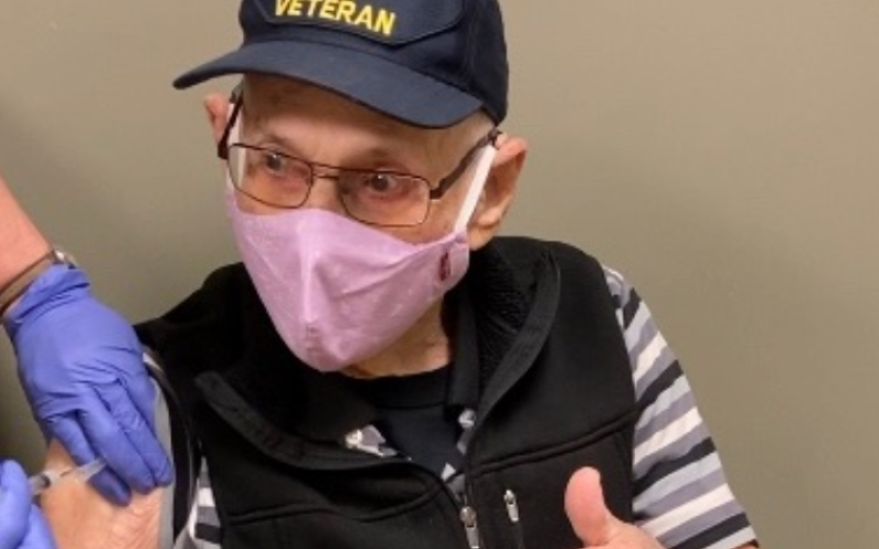 World War II veteran Ash Rothlein receives his second Moderna vaccination at the Clay County Health Department on Thursday. Rothlein, 96, is a recipient of the French Legion of Honor. He has dedicated much of his life to honoring those who died on the beaches of Normandy