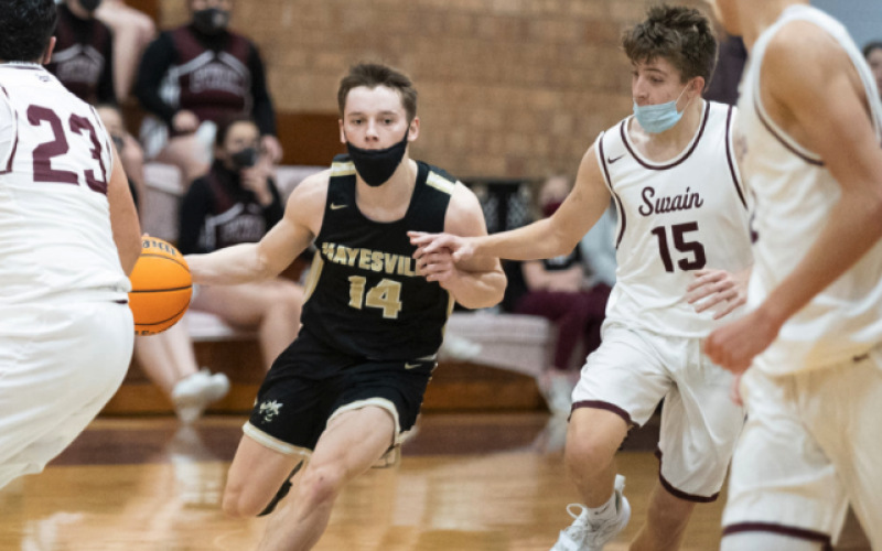 (Kelli Graves • Clay County Progress) Kolbe Ashe dribbles through a slew of Devils in Hayesville's exciting win over Swain.