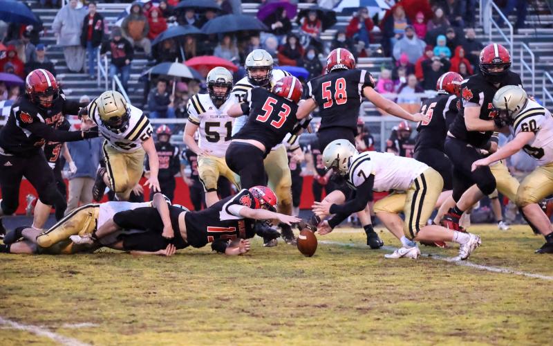(Kelli Graves • Clay County Progress) Kyle Lunsford goes for and recovers a loose ball after a Wildcat fumble.