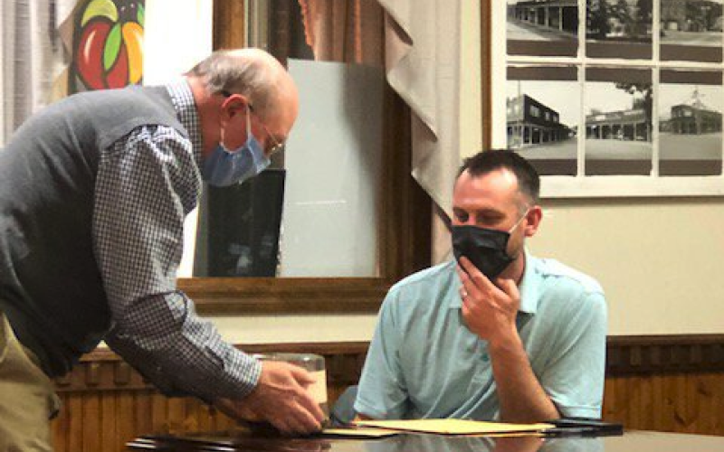 Lorrie Ross • Clay County Progress Hayesville Town Councilman Will Penland attended his last council meeting as a councilman. He is moving outside of town and gave his resignation. Mayor Harry Baughn presented a small cake to Penland, along with a card.