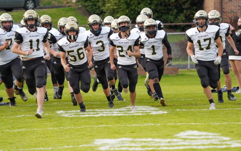 (Kelli Graves • Clay County Progress) The Yellow Jackets take the field for the final time to end the special spring season.