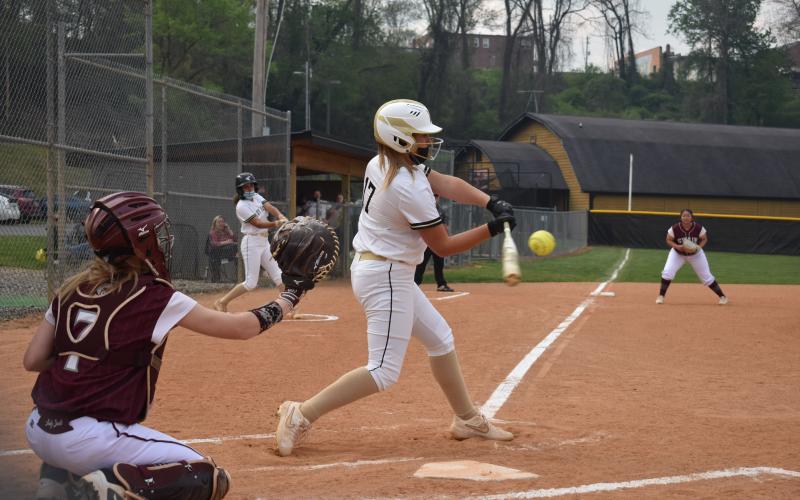 (Travis Dockery • Clay County Progress) Gracelynn Anderson sees a pitch she likes and pulls the trigger against Swain County.