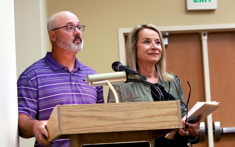 Jared Putnam • Clay County Progress Clay County Recreation Sports Coordinator Jerry Payne and County Manager Debbie  Mauney ask the Clay County Board of Commissioners to approve a Parks and Recreation  Trust Fund grant application during a special called meeting on Friday in Hayesville.