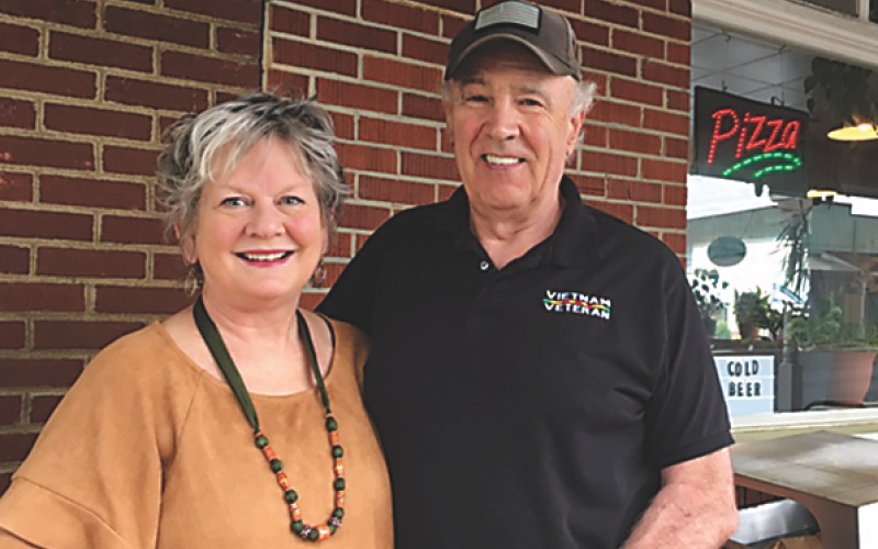 (Marcia Barnes • Clay County Progress) Marsha Lee Baker and Tom Baker stand outside the Clay County Progress building on their recent visit to Hayesville.