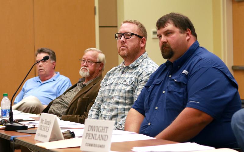 Clay County Commissioners Scotty Penland, Clay Logan, Rob Peck and Randy Nichols listen as Clay County Attorney Merinda Woody explains the details of the Residential Park Development Ordinance during a hearing on May 6 in Hayesville.