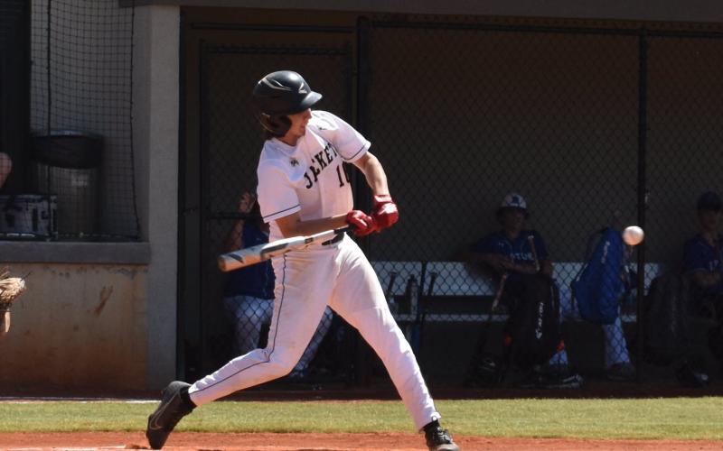 (Travis Dockery • Clay County Progress) Peyton Hunt takes a pitch to the opposite field for a base hit.