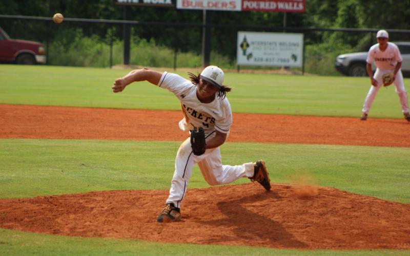 Brooke Leatherwood • Photo submitted Senior gun-slinger Jeremy Stewart slings a strike to his catcher in his perfect game against Cherokee.