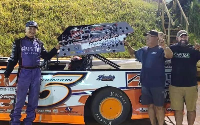 The “Chattanooga Flash” Ronnie Johnson, left, and his crew celebrate the main event win at Tri County Racetrack.